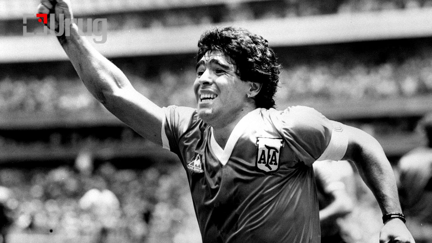 FILE PHOTO: Argentinian star Diego Maradona raises his arm in the air after scoring
