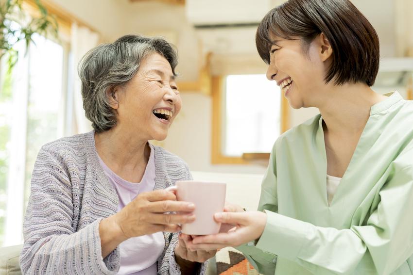 Home Grandmother and grandchildren drinking tea together.